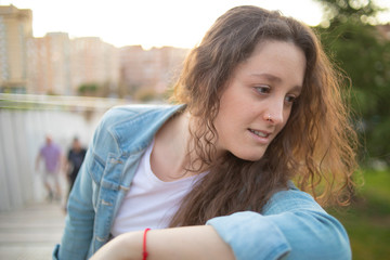 portrait of a girl in denim clothes outdoors
