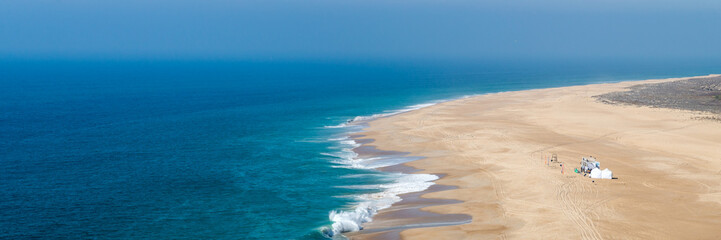 Sunny day on South African beach with big waves