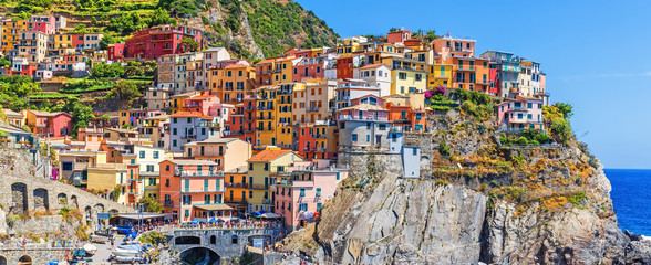 Panoramic view of Manarola village in Cinque Terre famous UNESCO travel destination in Italy....