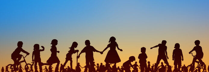 kids; group of children playing with sunset sky background; people silhouette -