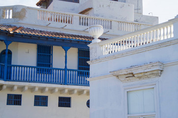 Walking the narrow and colorful streets with historic old buildings with wooden balconies and urban...