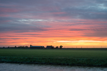 Textured clouds over the dutch landscape with a myriad of colors