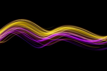 Long exposure photograph of neon pink and gold colour in an abstract swirl, parallel lines pattern against a black background. Light painting photography.