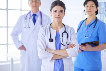 Fototapeta premium Group of doctors and nurses standing in the hospital room