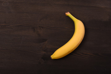Banana on black woodwn background