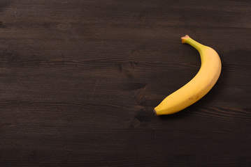 Banana on black woodwn background