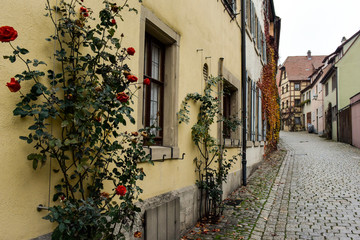 Narrow medieval street in old town Rothenburg ob der Tauber, Bavaria, Germany. November 2014