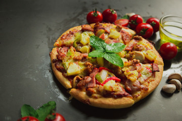 Top view of pork deluxe pizza,Tasty pork deluxe pizza on black background.