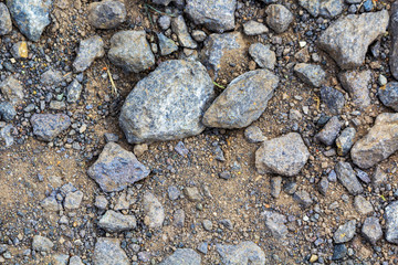 larger lumps of stone, gravel and sand as the foundation of a wind turbine