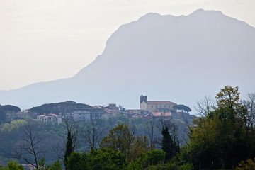 Fototapeta na wymiar ypical country of southern Italy. Montefredane, Avellino, Irpinia, Campania, Italy. The castle of Montefredane with the mount of Chiusano on the background.