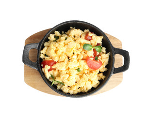 Tasty scrambled eggs with sprouts and cherry tomato in frying pan isolated on white, top view