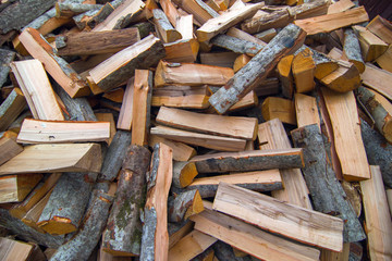 firewood for the fire, background. Dry chopped firewood logs ready for winter