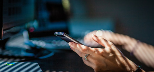 woman hands using smartphone, home office background, social media  influencer