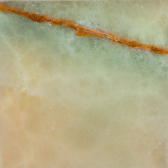 Natural yellow and aqua onyx closeup as a beautiful background