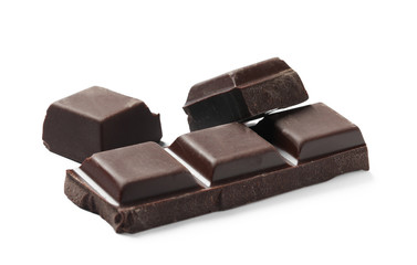 Pieces of delicious dark chocolate isolated on white