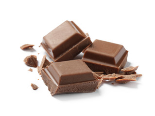 Pieces of delicious milk chocolate isolated on white
