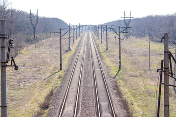 Old slightly rusty railroad tracks on which trains still ride.