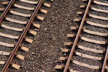 Old slightly rusty railroad tracks on which trains still ride.