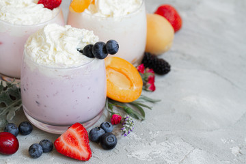 strawberry, blueberry smoothie on light background. well being and weight loos concept. milkshake with fresh berries. healthy Breakfast. fruit smoothie with ingredients.