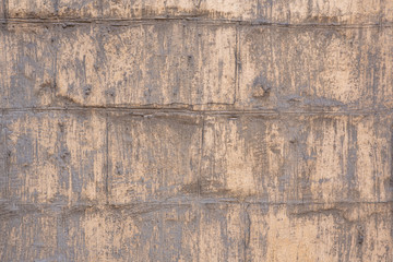 An old wall made of stone that looks like a brick.