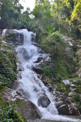 Refreshing waterfall during a trekking tour in northern Thailand