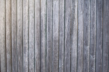 The texture of the boards. Brown painted fence.