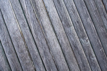 The texture of the boards. Brown painted fence.