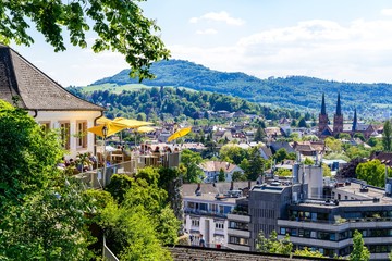 Obraz premium Aerial view on church, city of Freiburg im Breisgau, Beer garden. Baden-wurttemberg, Germany