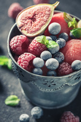 Cold ice cream sorbet with fresh berries and mint leaf