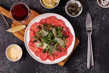 Marbled beef carpaccio with arugula, capers and parmesan cheese