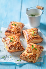 Homemade sausage roll as for breakfast on blue table