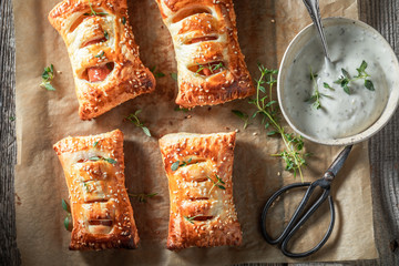Top down view of sausage roll with herbs