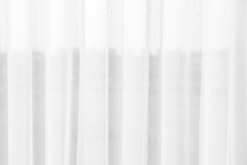 Obraz premium airy or thin and transparent white curtain with texture for see through and soft light on window and close in the room for virgin home or hotel interior decor and bright architecture background