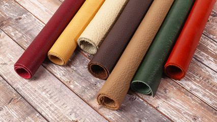 Rolled up multicolored natural leather textures samples