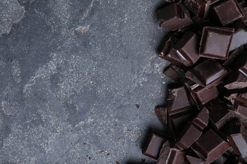 Delicious dark chocolate on light grey table, flat lay. Space for text