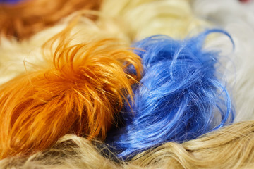 Hair texture from multi-colored wigs, synthetic and natural.