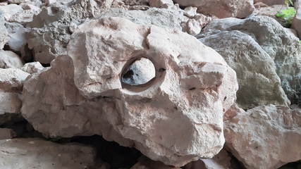 A rock with a round hole