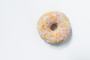 Appetizing sweet donut on a white background. Top view