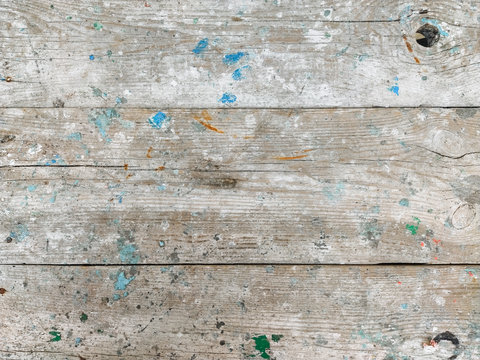 Texture of a dirty, paint-stained gray cracked wood plank. Photography, concept.