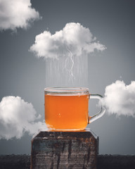 Fototapeta na wymiar cloud raining tea inside cup