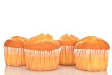 Tasty sweet muffins, close-up, on a white background.