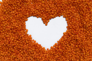 Red lentils isolated on white background. Top view.