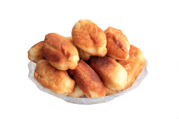 photo of fried pies on a plate isolated. Fried patties on a white plate over white background . fried pies in a white plate