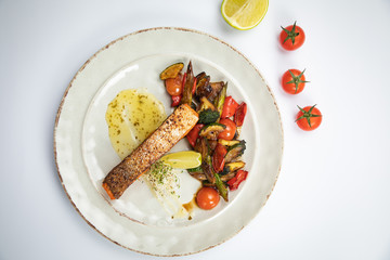 grilled salmon fish with vegetables and lime 