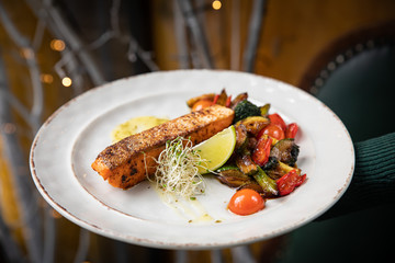grilled salmon fish with vegetables and lime 