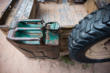 Luggage rack on car with gasoline and tire