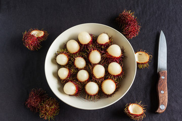 Rambutan, a delicious Thai fruit served on a plate