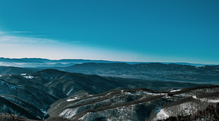 Fototapeta na wymiar Mountain blue sky winter time