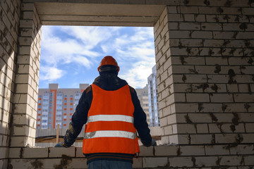 View from the window of an unfinished house on new multi-storey buildings. Photographed on a wide angle lens