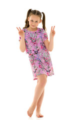 Little girl holding two fingers up. Gesture.